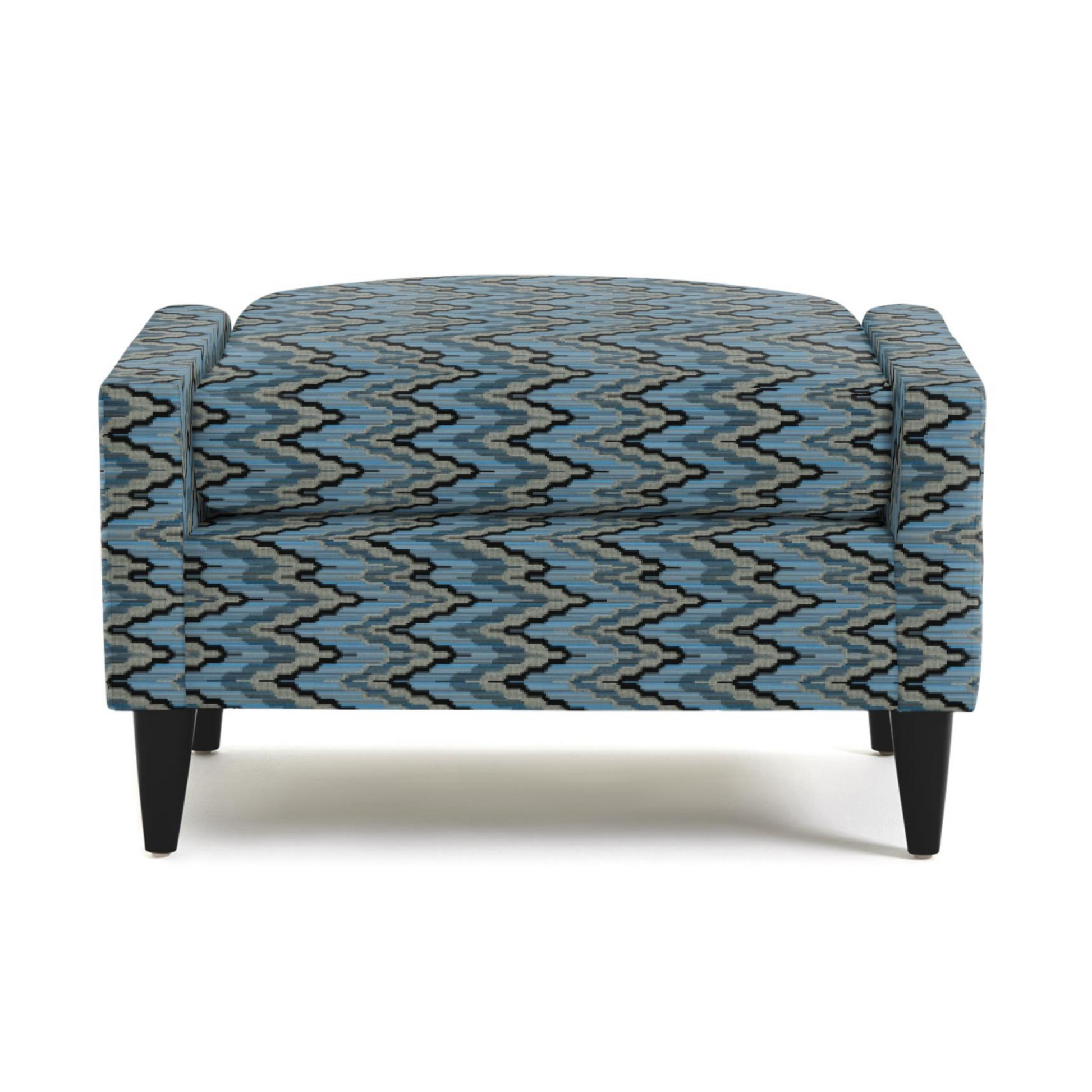 Modern accent chair with blue and gray zigzag patterned upholstery and dark wooden legs — stylish mid-century living room furniture.