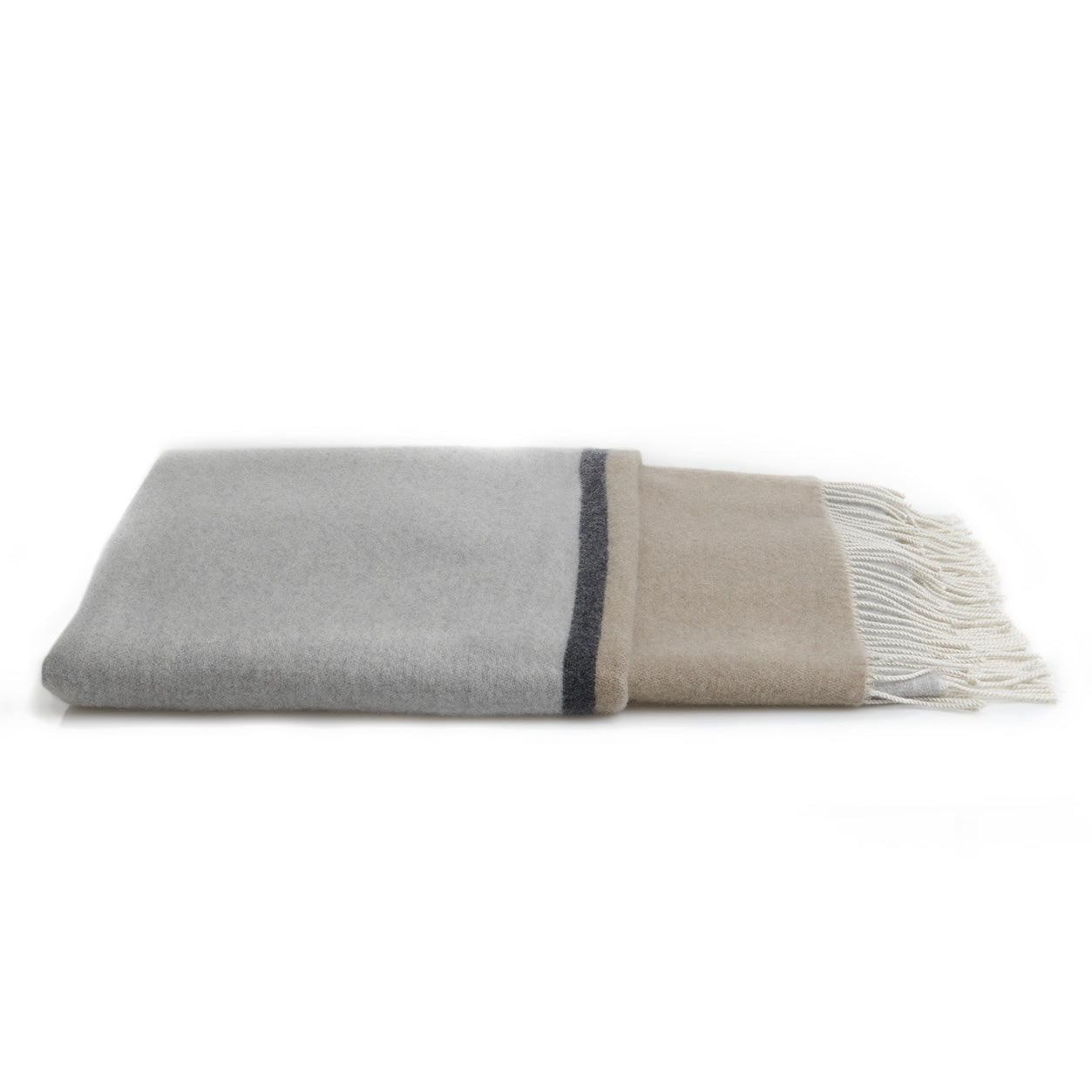 Folded gray and beige blanket with fringes on a white background