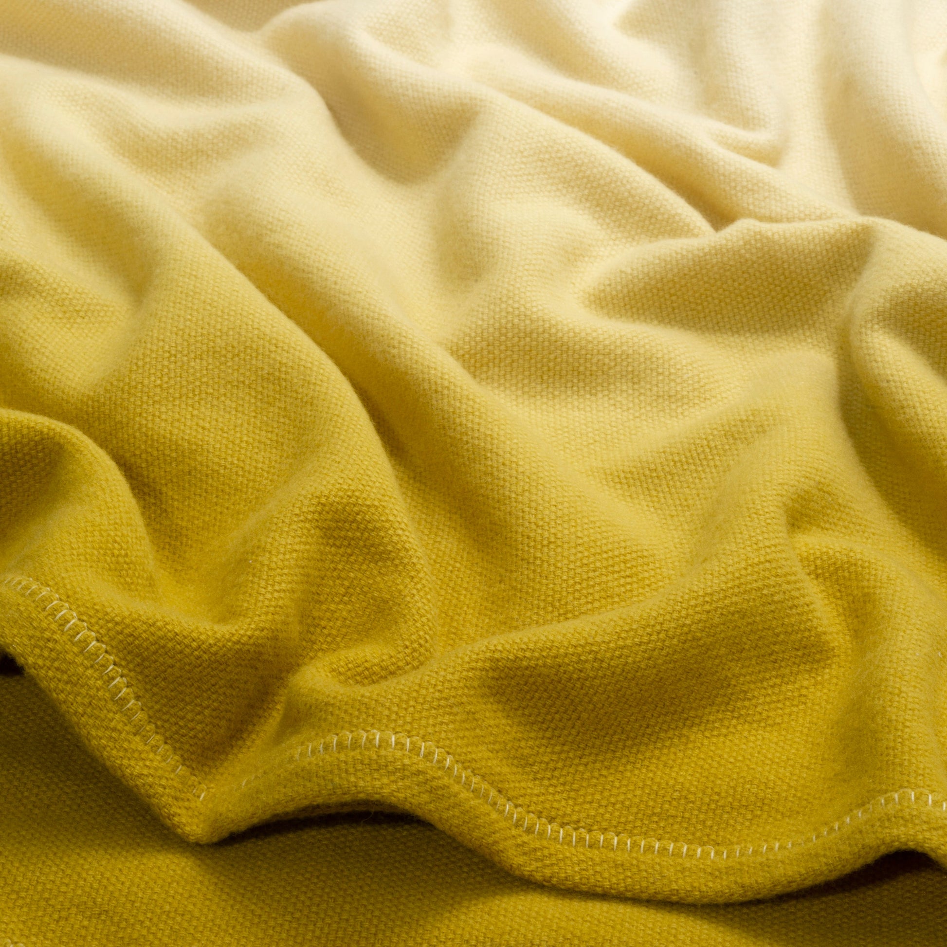 New Spring Ombre Throw in Amber Gold by Fineza – soft gradient decorative blanket.