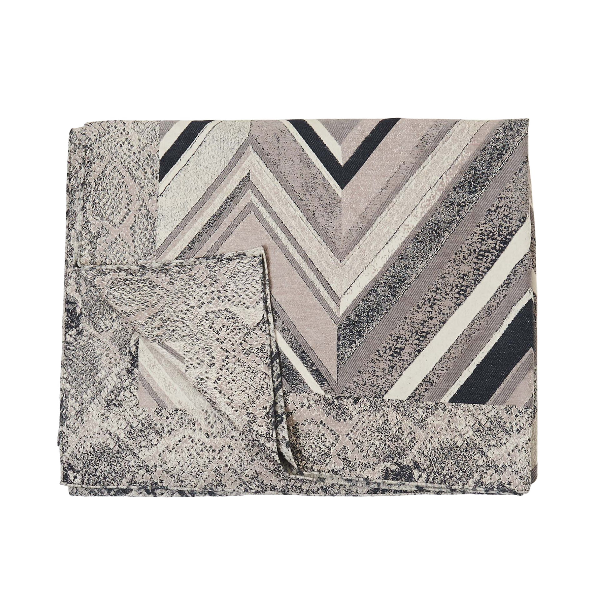 Jerome Chevron Throw in grey by Fineza – soft woven blanket with modern chevron pattern on white background.